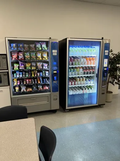 Customer using the touchscreen on a snack machine